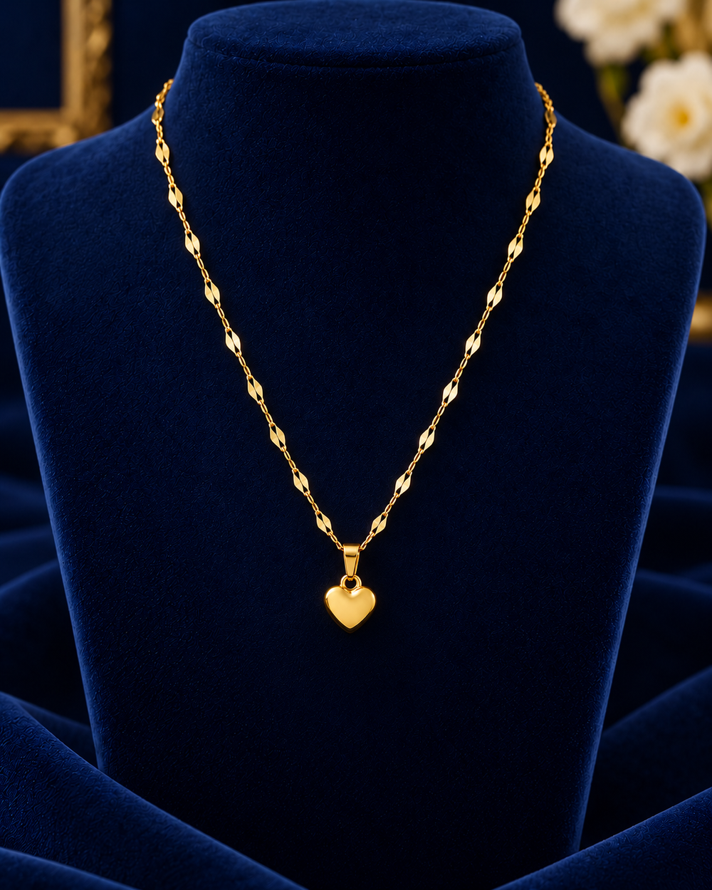Gold-Tone Polished Heart Necklace on navy velvet display