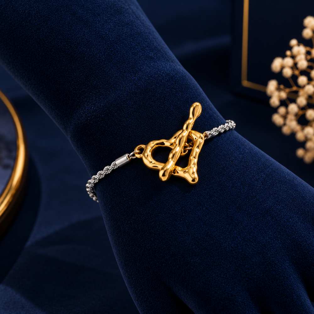 Two-Tone Heart Toggle Bracelet on navy velvet display