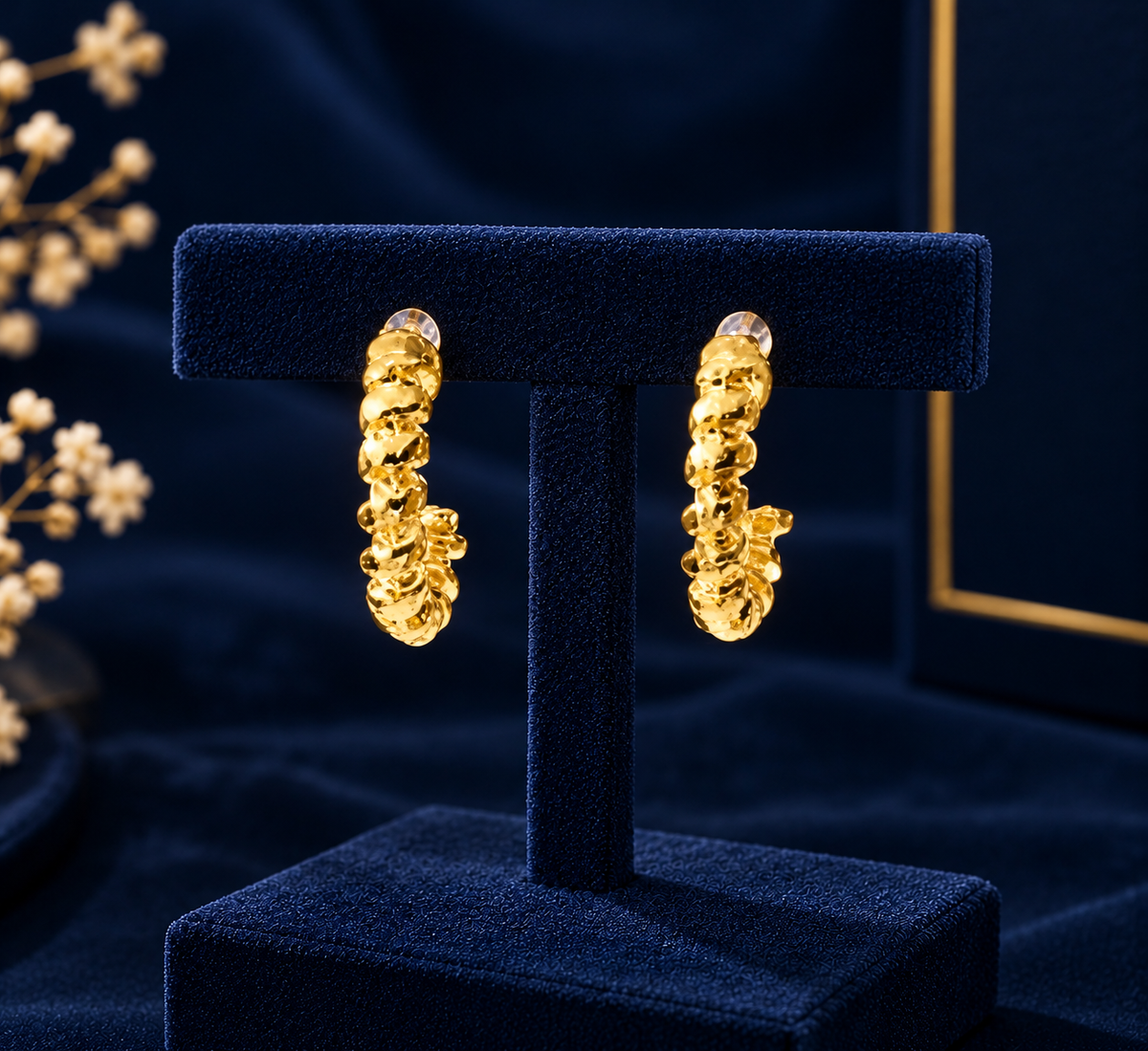 Gold-Tone Mini Textured Hoop Earrings on navy velvet display