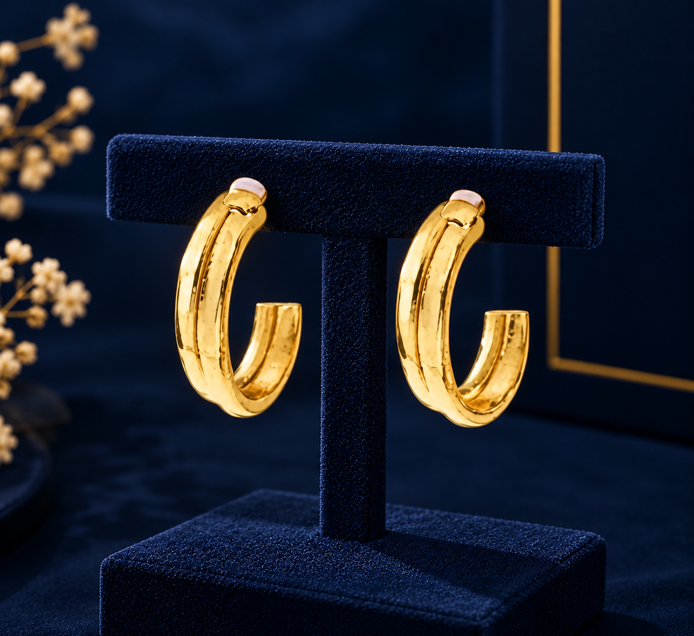 Gold-Tone Classic Rounded Hoop Earrings on navy velvet display