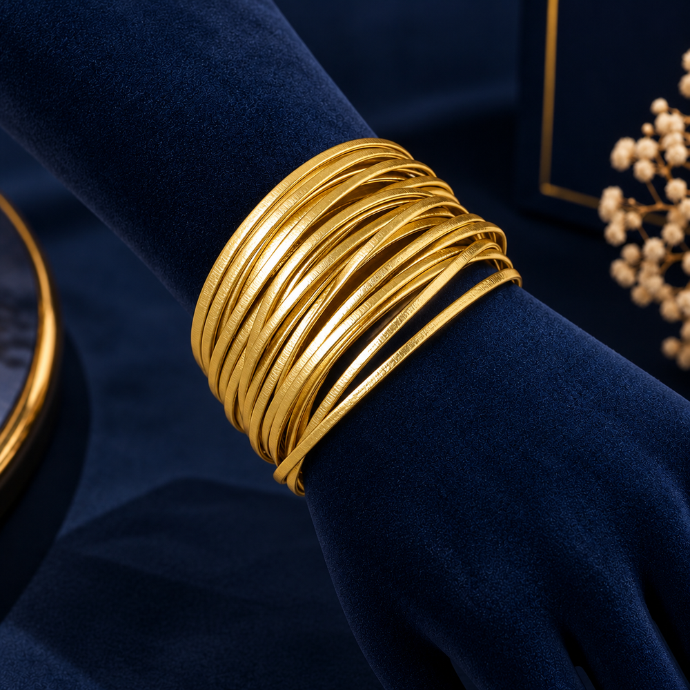 Gold-Tone Multi-Strand Bracelet With Magnetic Clasp on navy velvet display