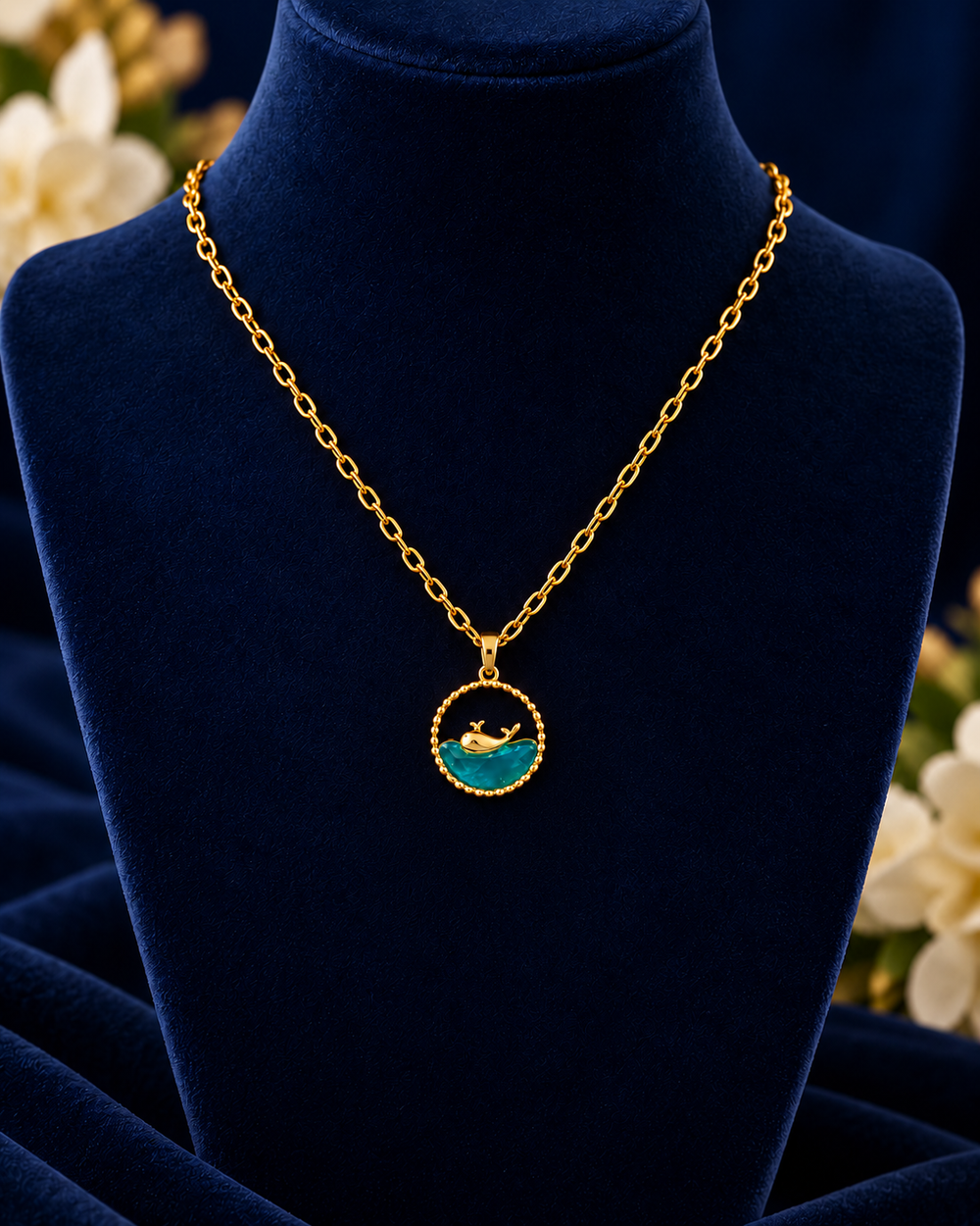 Gold-Tone Ocean Wave Necklace on navy velvet display
