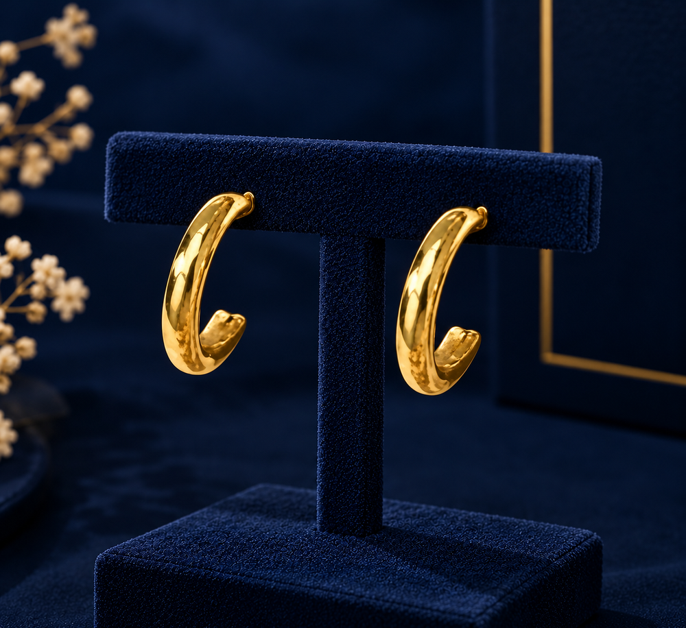 Gold-Tone Small Open Hoop Earrings on navy velvet display