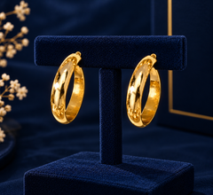 Gold-Tone Medium Open Hoop Earrings on navy velvet display
