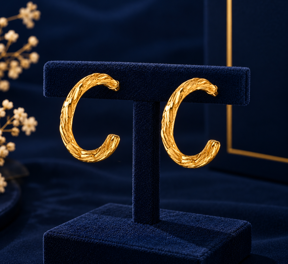 Gold-Tone Large Open Hoop Earrings on navy velvet display