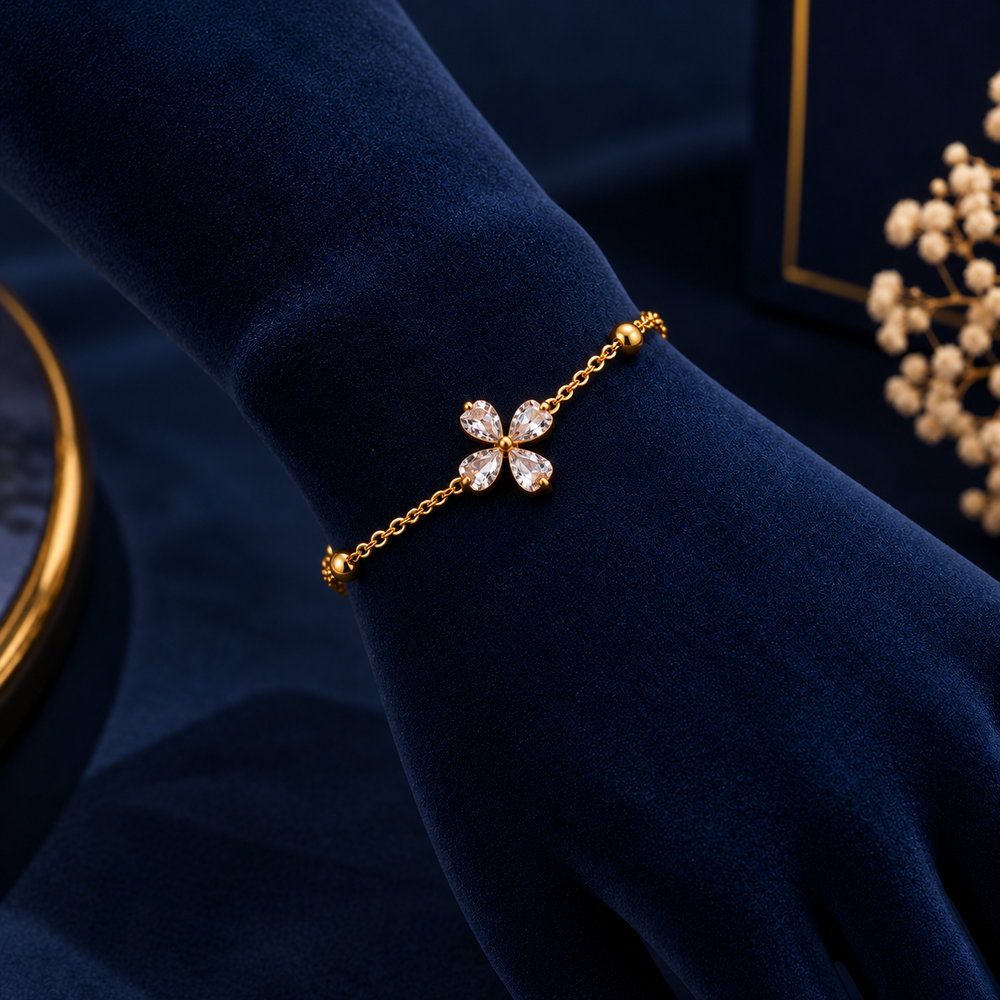 Gold-Tone Four-Petal Crystal Bracelet on navy velvet display