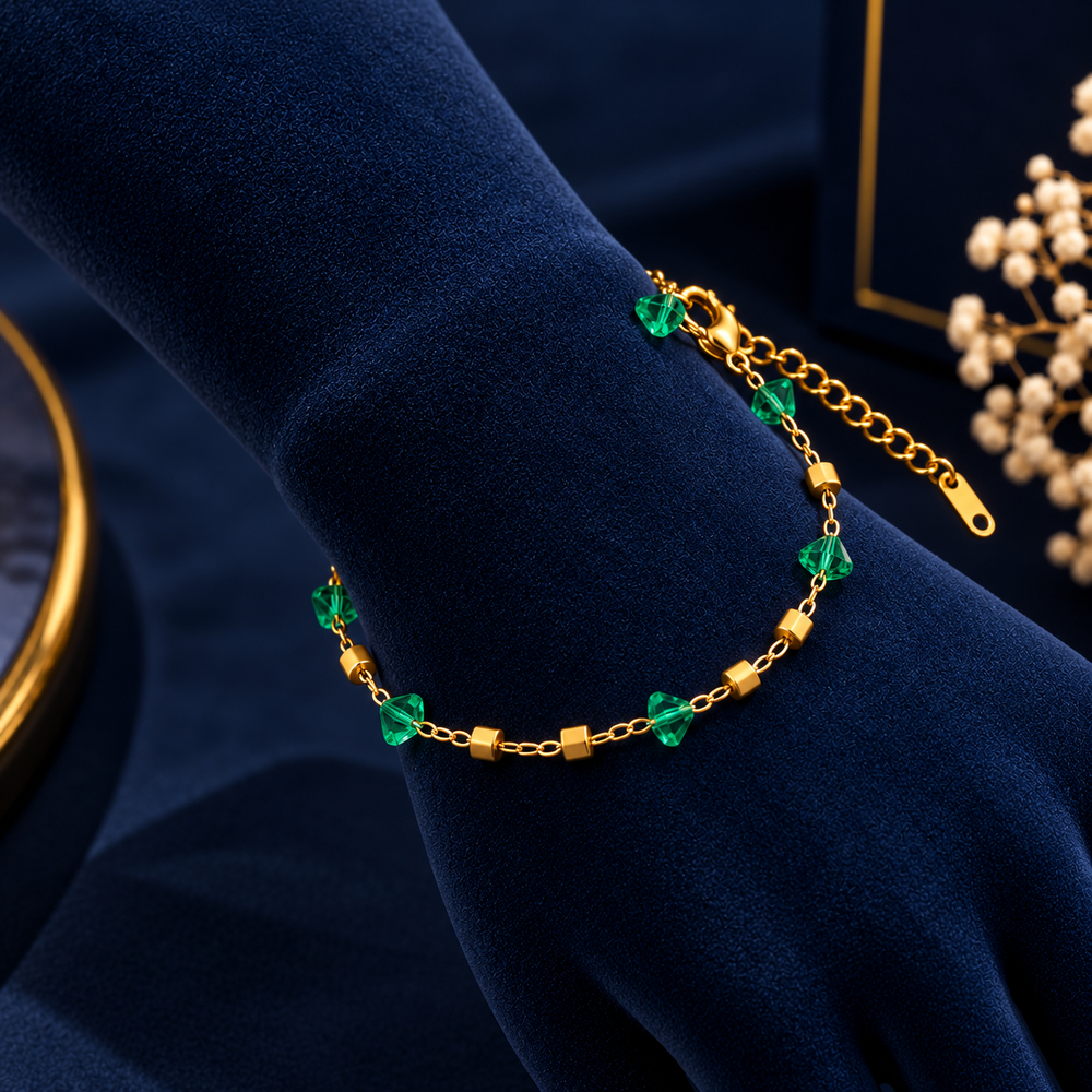 Gold-Tone Green Crystal Bead Bracelet on navy velvet display