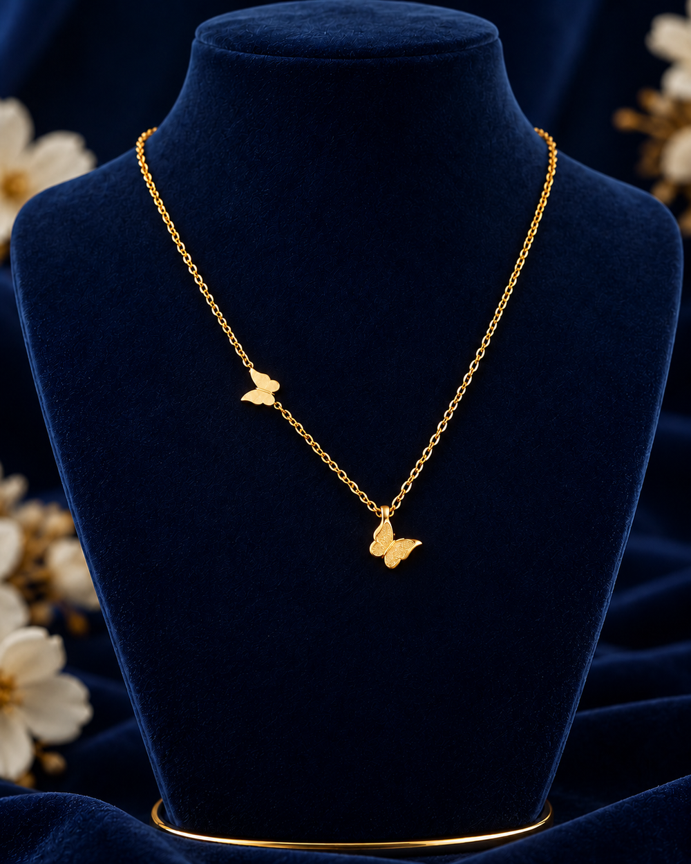 Gold-Tone Double Butterfly Necklace on navy velvet display