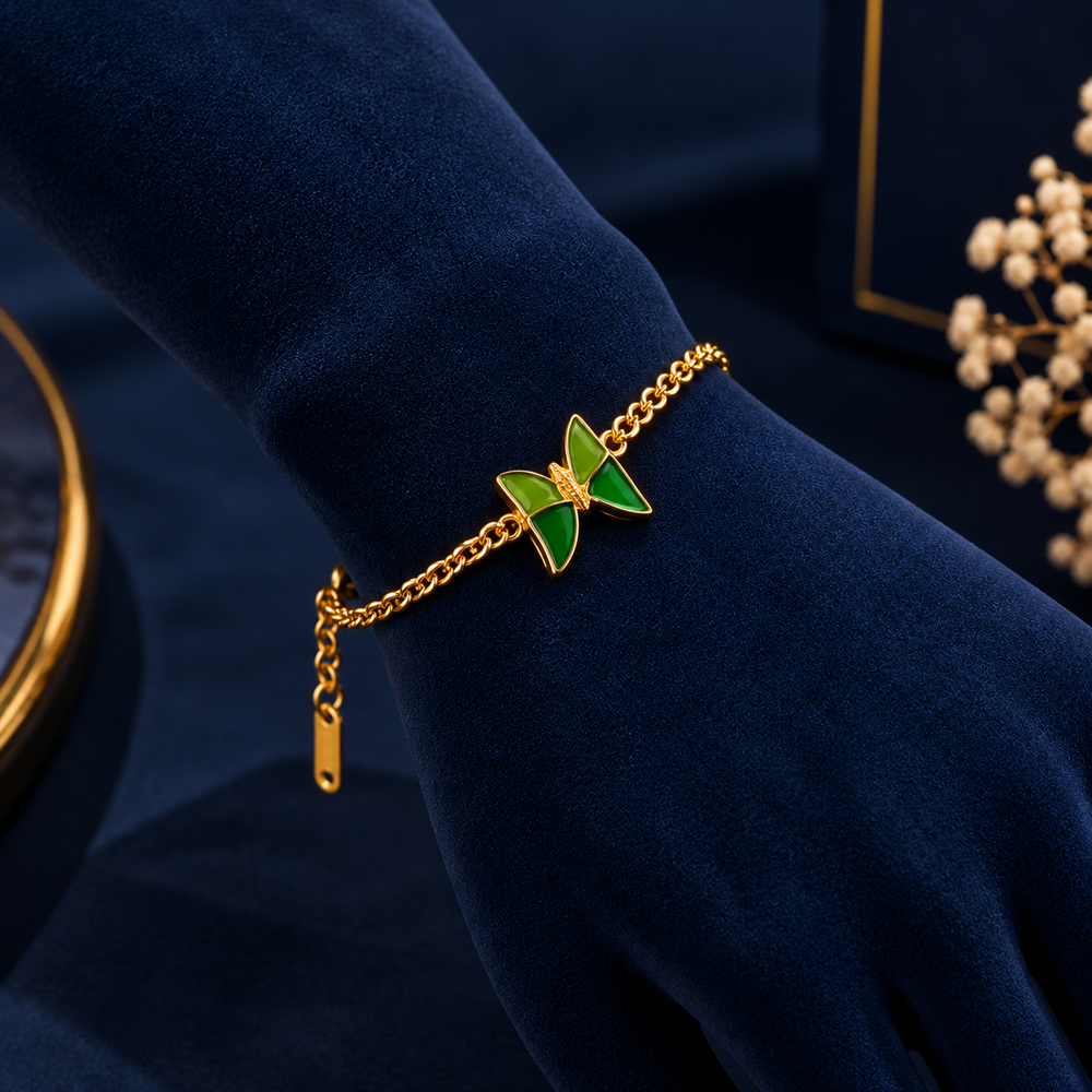 Gold-Tone Green Butterfly Bracelet on navy velvet display