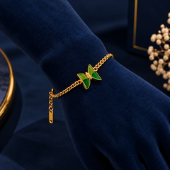 Gold-Tone Green Butterfly Bracelet on navy velvet display