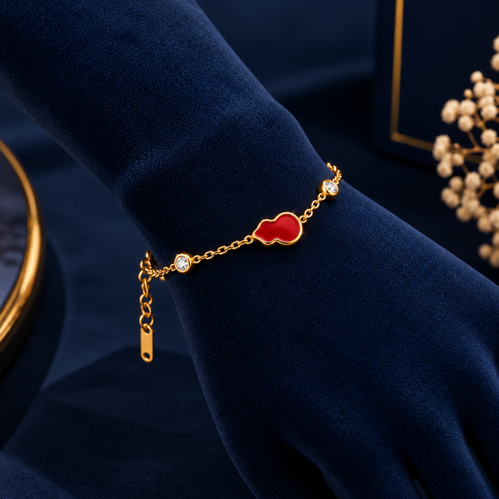 Gold-Tone Red Gourd Double Crystal Bracelet on navy velvet display