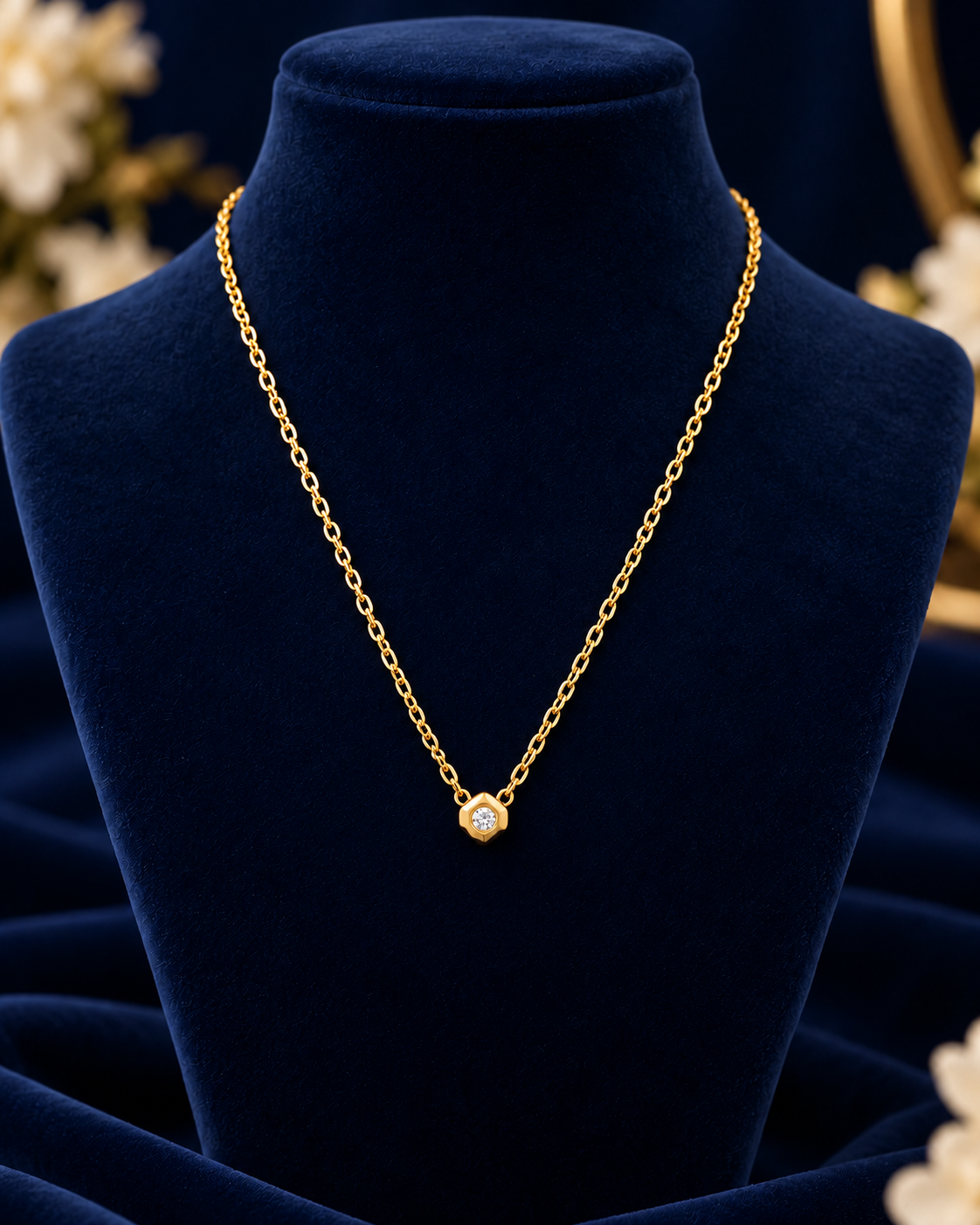 Gold-Tone Geometric Crystal Necklace on navy velvet display