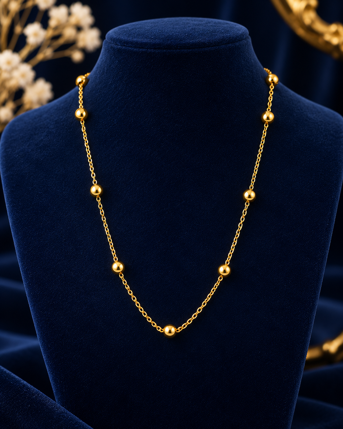 Gold-Tone Beaded Chain Necklace on navy velvet display