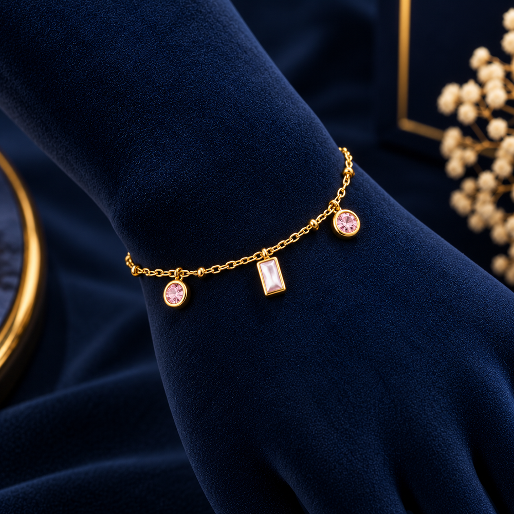 Gold-Tone Pink Geometric Crystal Bracelet on navy velvet display