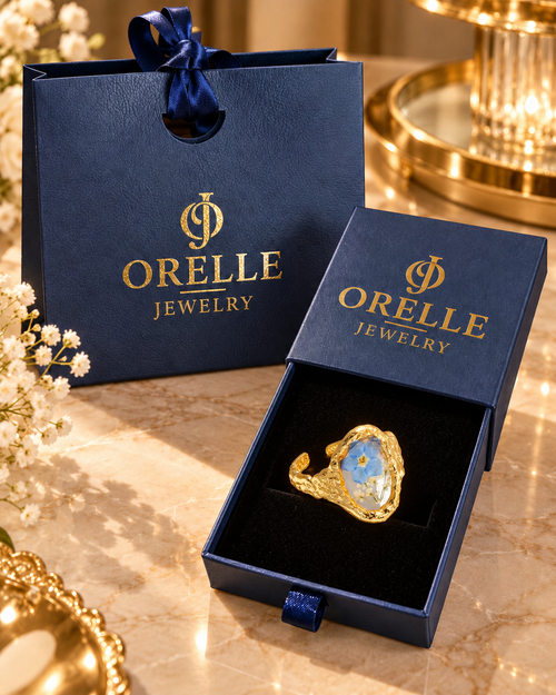 Gold-Tone Blue Flower Drop Ring in Orelle packaging