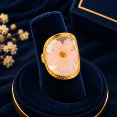 Gold-Tone Pink Floral Statement Ring on navy velvet display