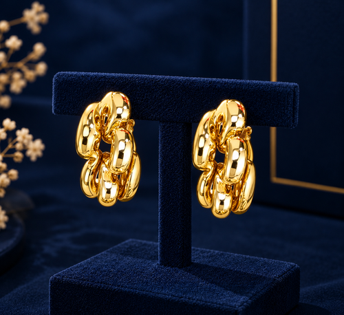 Gold-Tone Chain Link Hoop Earrings on navy velvet display
