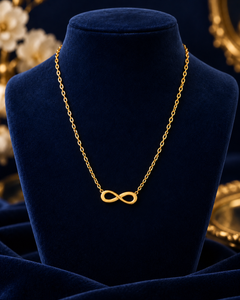 Gold-Tone Infinity Necklace on navy velvet