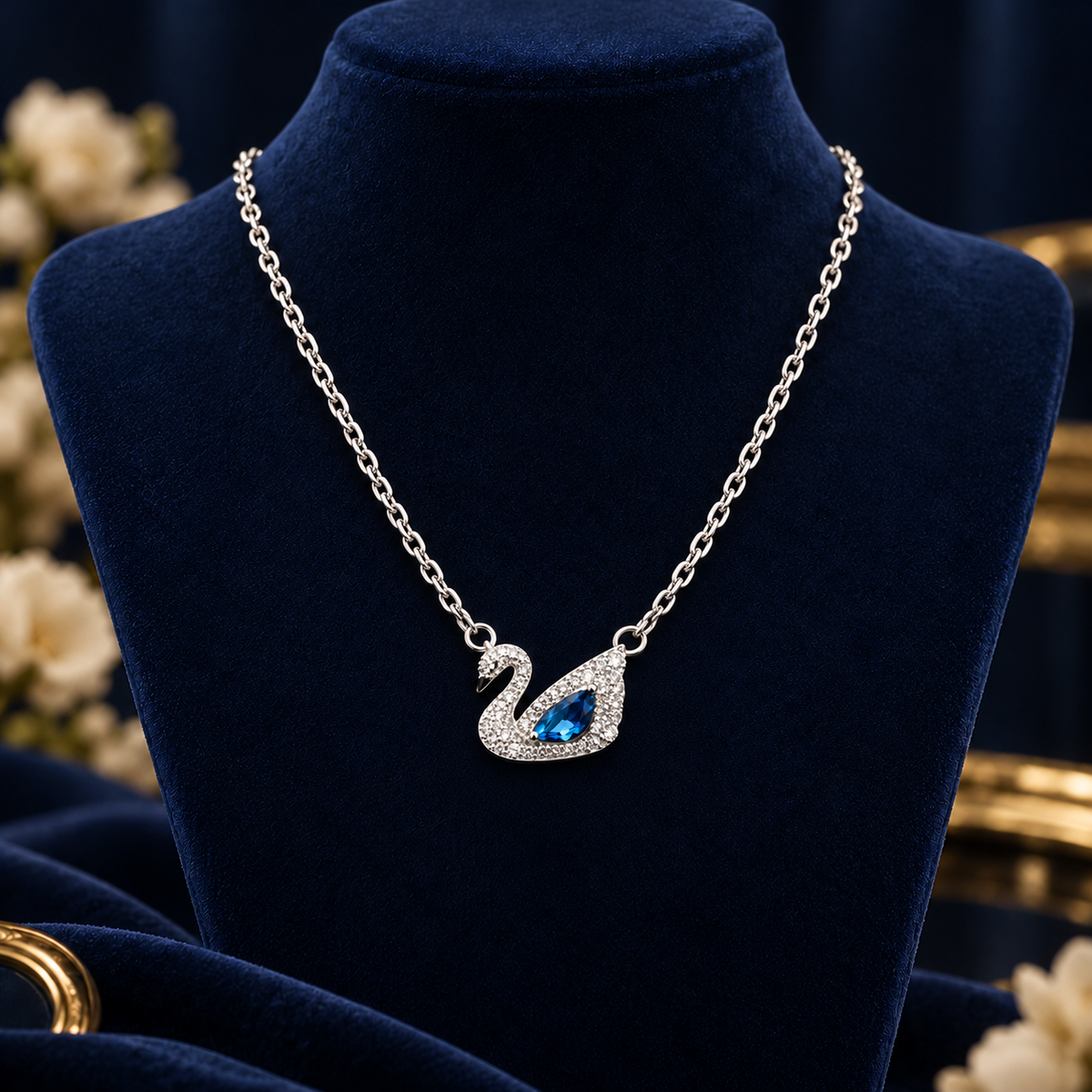 Silver-Tone Blue Swan Necklace on navy velvet