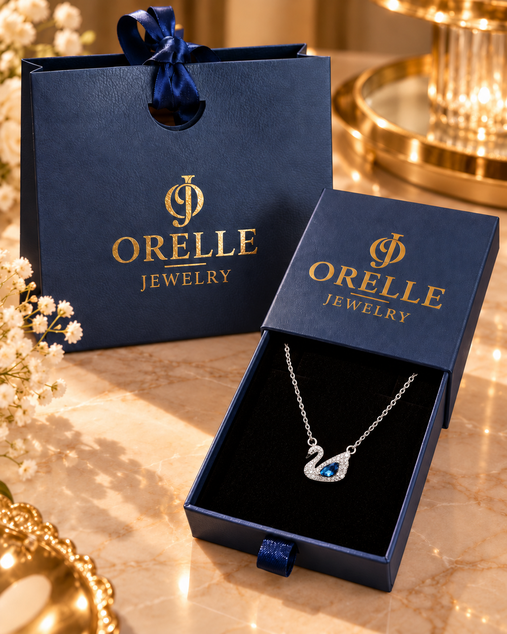 Silver-Tone Blue Swan Necklace inside Orelle gift packaging