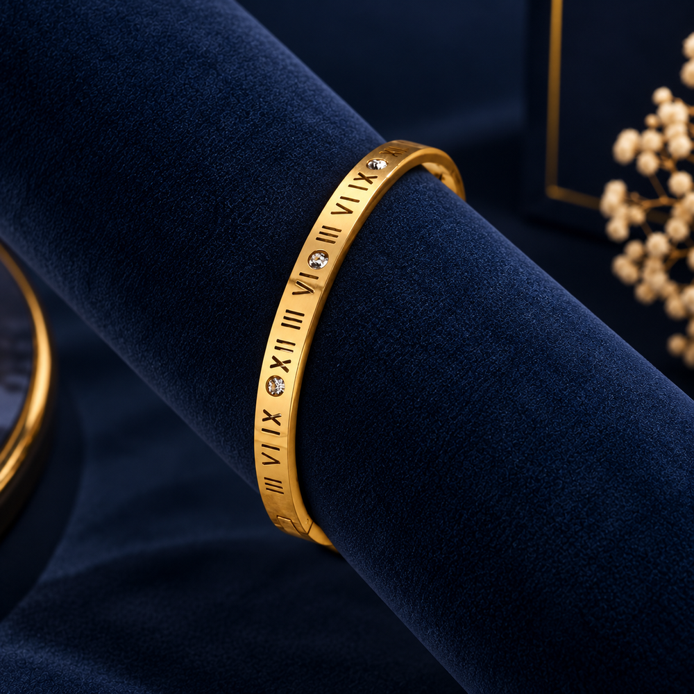 Gold-Tone Roman Numeral Crystal Bangle on navy velvet