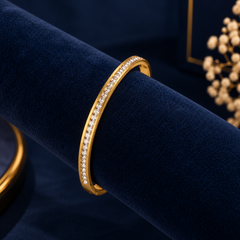 Gold-Tone Crystal Line Bangle on navy velvet